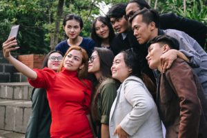 Group members taking pictures as evidence for outdoor team building activities in Malaysia